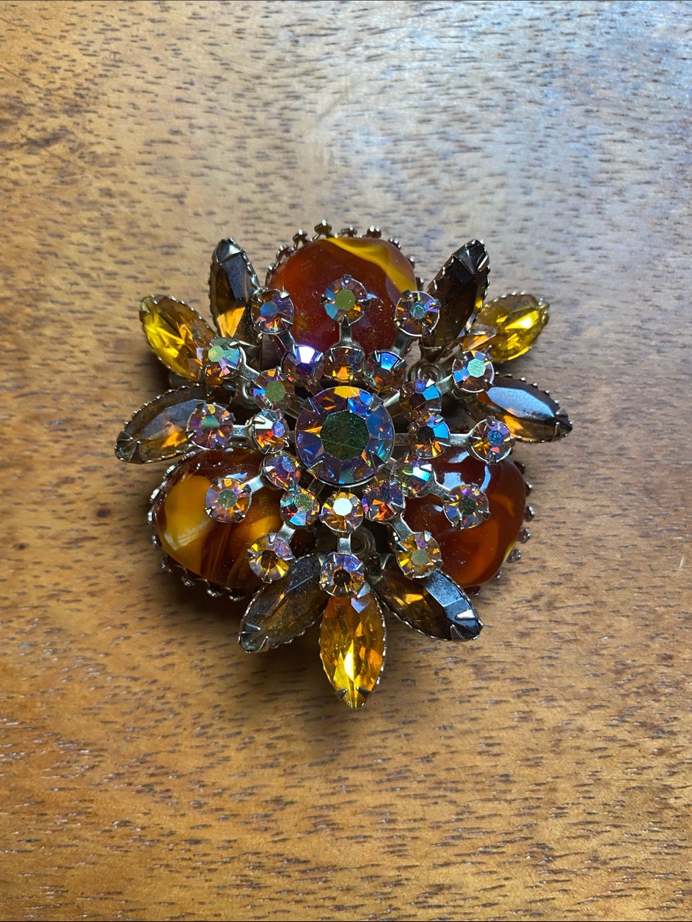 Vintage signed Judy Lee brooch in amber and topaz colors.